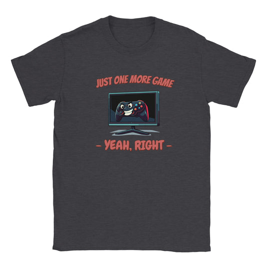 Dark gray t-shirt. Monitor in the center of the shirt. On the screen is a game controller with a manic-looking face.

Above the controller are the words, "Just one more game" in pale, light red with a dark red drop shadow.

Beneath the monitor are the words, "Yeah, right" in pale, light red with a dark red drop shadow.