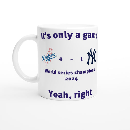 White coffee mug with the Dodgers and New York Yankees score from the world series 2024.

At the top are the words, "It's only a game" in dark blue.

Under the score are the words, "Yeah, right" in dark blue