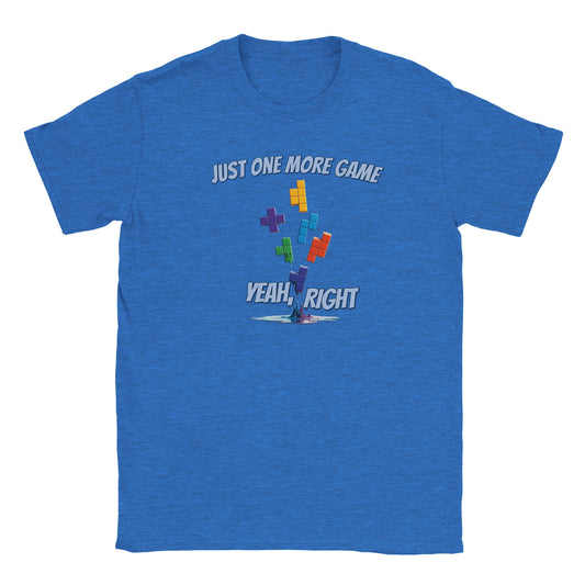 Light blue t-shirt. Falling tetris blocks that gradually melt into a puddle.

Above the blocks are the words, "Just one more game" in light blue with a dark blue drop shadow.

Just above the melted puddle of bricks are the words, "Yeah, right" in light blue and dark blue drop shadow