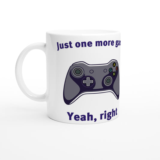 White coffee mug. Xbox-style game controller in the middle

At the top are the words, "Just one more game" in dark blue.

At the bottom are the words, "Yeah, right" in dark blue.