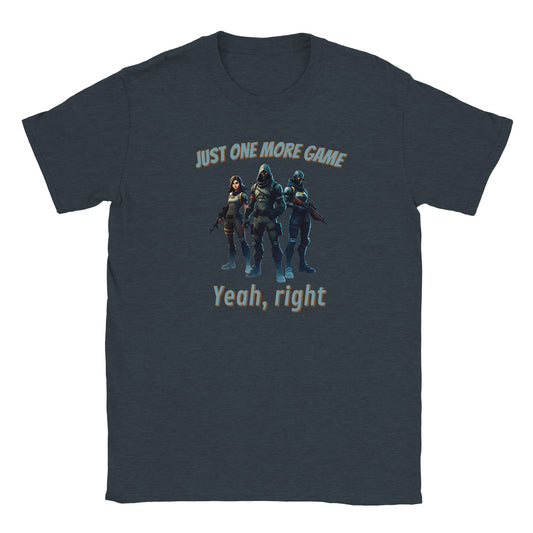 Midnight blue t-shirt. In the center are fully colored three video game characters. In the center is a powerful futuristic ninja. To his right is a woman holding a rifle and has cat ears on her head. 

To his left is a cyborg holding a hunting rifle.

Above are the words, "Just one more game" in pale, light blue with a dark orange drop shadow.

Underneath are the words, "Yeah, right" in pale, light blue and a dark orange drop shadow.