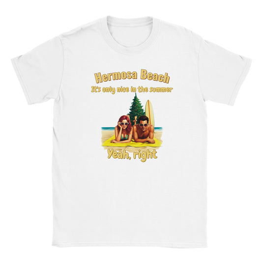 White t-shirt with stylized male and female sunbathers lying on their stomach looking at the camera, on the sand.

Behind them are are christmas tree and a surf board propped next to the tree.

The words, "Hermosa beach" are at the top, written in yellow with a dark yellow drop shadow.

Under that are the words, "It's only nice in the summer" written in yellow with a dark yellow drop shadow.

Beneath the picture are the words, "Yeah, right" written in yellow with a dark yellow drop shadow